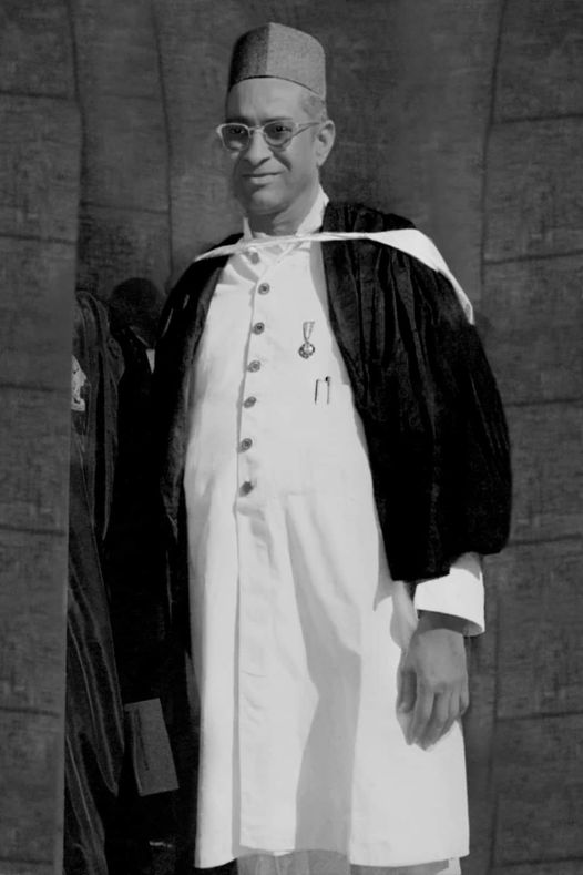 Black-and-white portrait of Pandit Suryanarayan Vyas in a ceremonial robe and cap